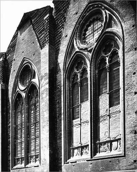 Windows with two lights on the south side of the Basilica of San Petronio in Bologna