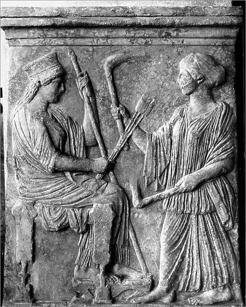 Votive relief representing Demetra and a female figure; work preserved in the Museum of Eulisis