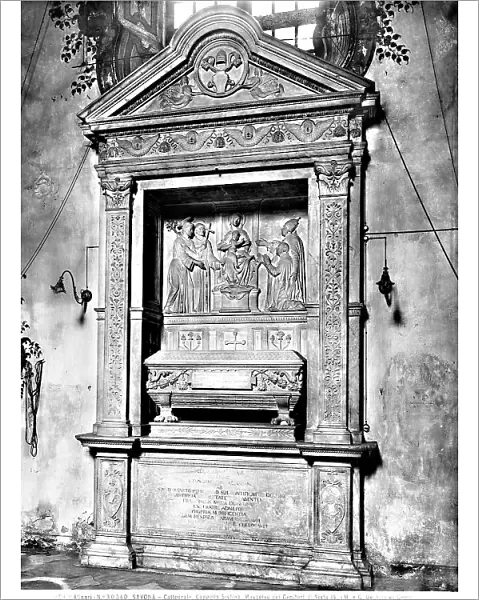 Funereal monument of Leonardo della Rovere and Luchina Monleone, parents of Sisto IV, in the form of a finely sculpted gabled niche. In the center is a relief with the two deceased presented to the Madonna and Child