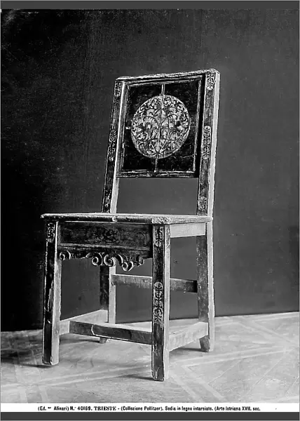 Istrian chair with wooden inlay and decorative elements on the back reproducing leaf spirals and birds in flight. Pollitzer Collection, Trieste