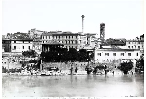 View of the opening of the Cloaca Massima in the Tiber river, Rome. In the background, the bell tower of the Church of Santa Maria in Cosmedin is visible