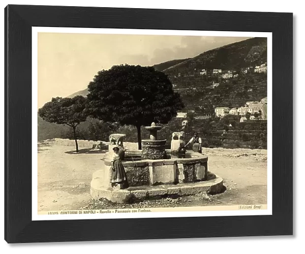 Two little girls take water from a fountain in the environs of Ravello, near Salerno