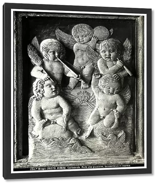 Bas relief with winged putti playing in the water and playing musical instruments. Work by Agostino di Duccio located in the Chapel of Children's Games in the Malatesta Temple, Rimini