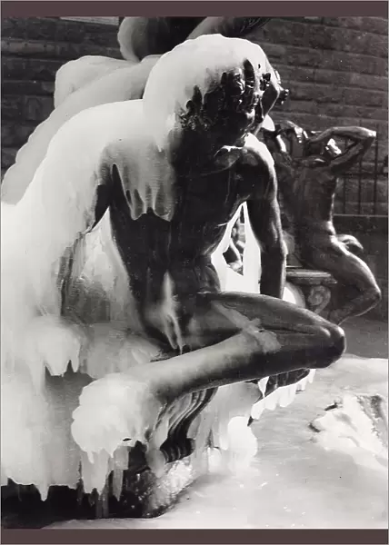 One of the tritons of the Neptune fountain in Piazza della Signoria with snow and ice