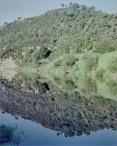 Reflection of a hill on the river in Limite