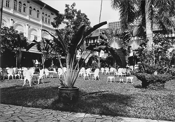 Tables and chairs in the garden of a hotel in Singapore