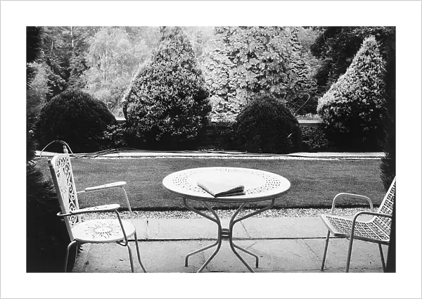 Table and chairs in a garden, in Surrey, Kent, in Great Britain