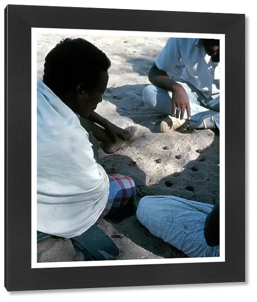 Lower Juba. A Somalian game similar to checkers that is played by making holes in the ground and moving the stones to prevent the adversary from passing