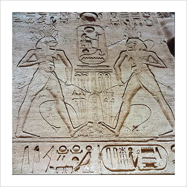Relief at the entrance of the Great Temple of Ramses II in Abu Simbel, showing the pharaoh uniting the heraldic plants of Upper and Lower Egypt, symbolizing the unity of the one nation