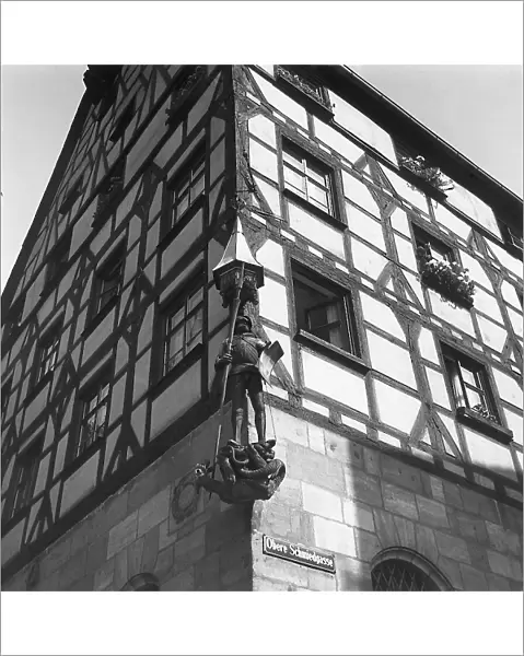 An old building with a statue of St. George in Nuremberg