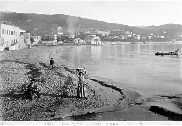 The beach of San Remo: in the background, the town and a few people in the foreground