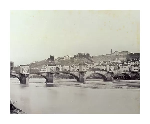 The Ponte alle Grazie'. Over a dry Arno, with large weirs. In the background the town and hills of San Miniato
