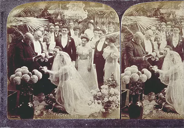 A moment at a wedding ceremony set in an Interior with lush plants. The participants are wearing elegant clothes according to the late Nineteenth century or turn of the century fashion