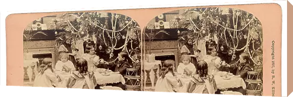 Internal view of a house on Christmas time. Portrait of a group of children sitting around a little table while making a tea ceremony near the Christmas tree, pictured by B.W. Kilburn, 1897, Colorado, New Hampshire, Littleton
