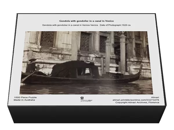 Gondola with gondolier in a canal in Venice