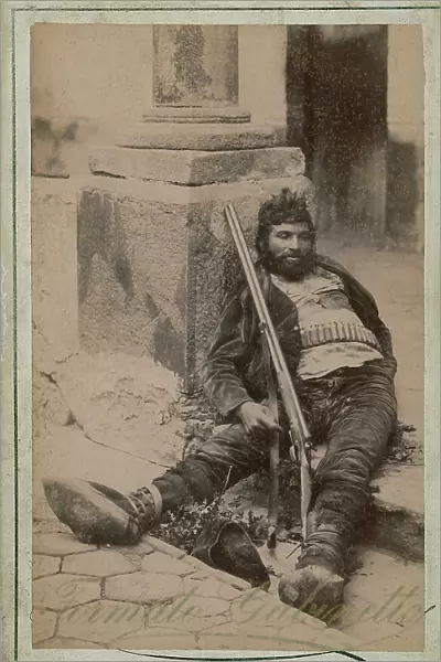 Post mortem portrait of a brigand, lying on the cobblestones