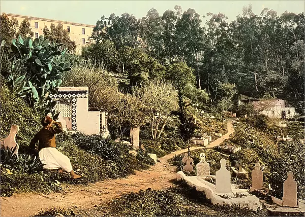 Algiers cemetery, with a man in traditional dress