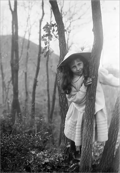 Portrait of a girl posing among trees