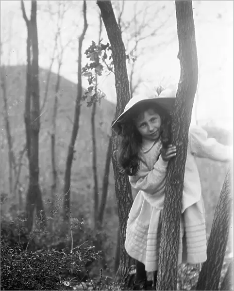Portrait of a girl posing among trees