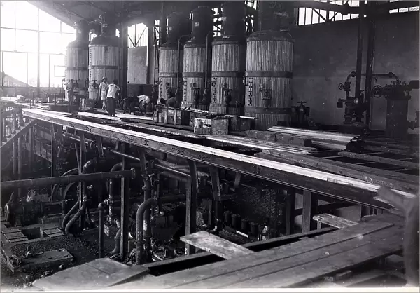 Interior of a sugar factory in Somalia with men at work