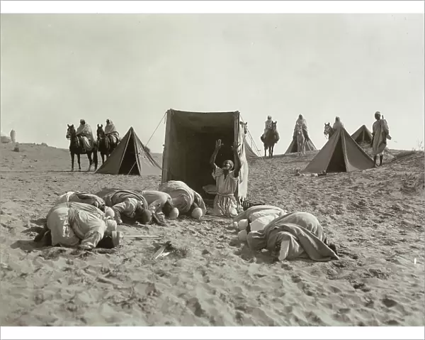 Natives praying in the desert