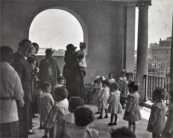 Benefactors with children of a kindergarten