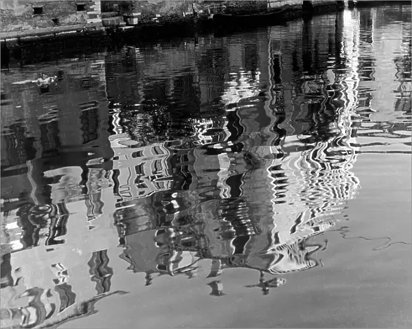 'Reflections of houses' Profiles of houses reflected in a Venetian canal