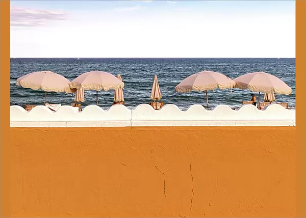 Florida, Palm Beach, colorful beach umbrellas facing the ocean