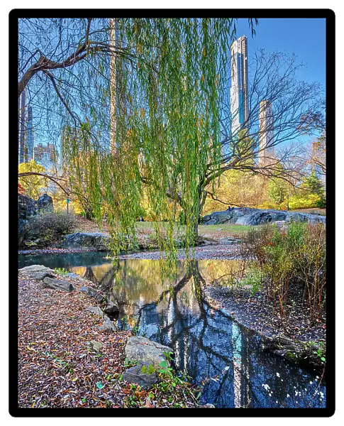 New York City, Central Park, billionaire's row skyline reflected on Central Park's the pond