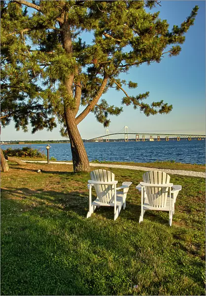 Rhode Island, Newport, view of adirondack chairs with Claiborne Pell Bridge