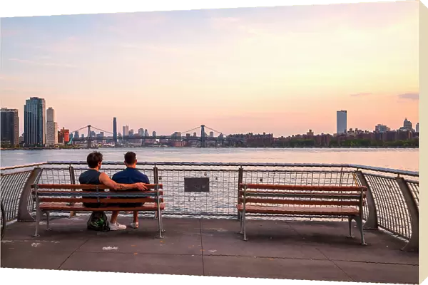 New York City, couple admiring view from WNYC Transmitter Park located in the Greenpoint neighborhood of Brooklyn