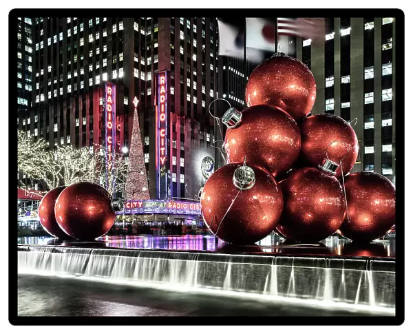 New York City, Manhattan, Midtown, Radio City Music Hall, fountain with large red Christmas ball ornaments