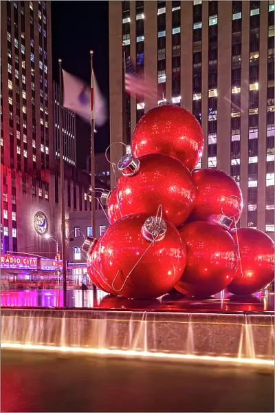 New York City, Manhattan, Midtown, Radio City Music Hall, fountain with large red Christmas ball ornaments