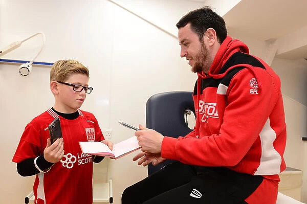 Bristol City's Lee Tomlin Meets and Signs for a Young Fan Before Fulham Match