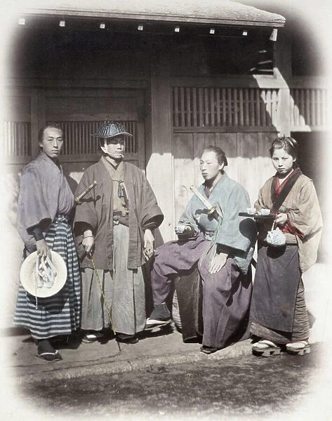 1860s Japan - portrait of a samurai group being served by a tea house servant Felice or