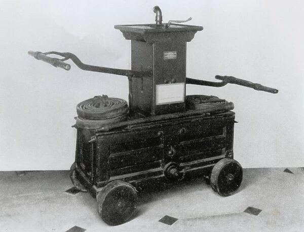18th century fire engine with leather hose and other fitting