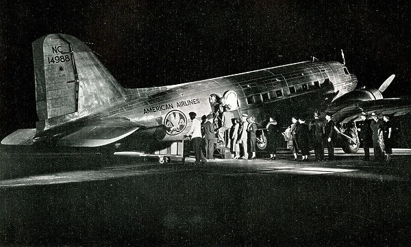 American Airlines passengers boarding a night flight