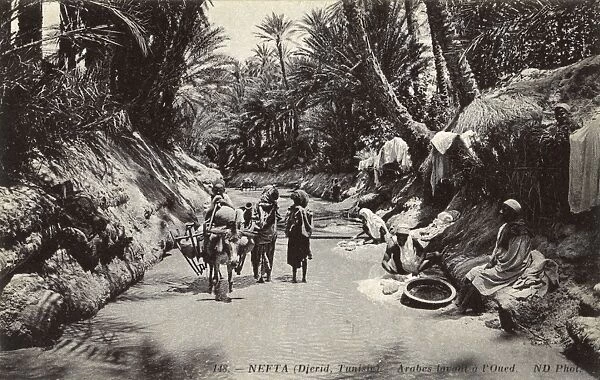 Arabs washing clothes, Nefta, Tunisia, North Africa