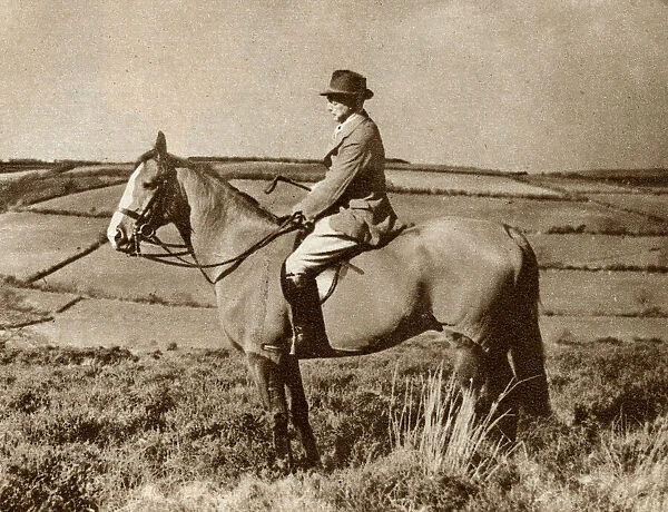 The artist, Alfred Munnings, riding a horse in Somerset