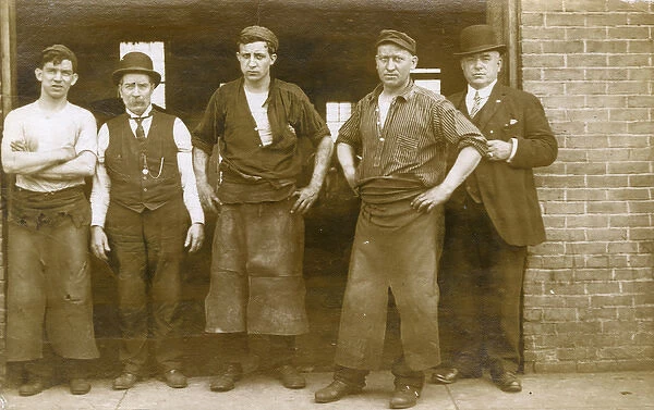 Blacksmiths outside their foundry or forge, USA