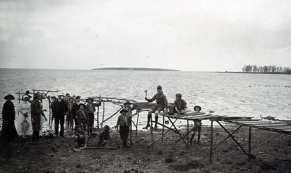 Boy scouts building a wooden jetty, Mauritius