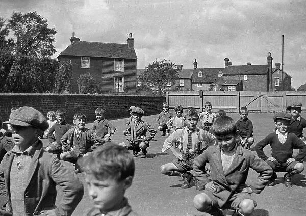 Boys exercising in school playground