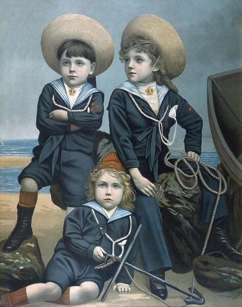 Three boys in sailor suits on beach