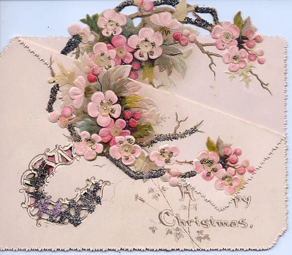Branch of pink blossom on a cutout Christmas card