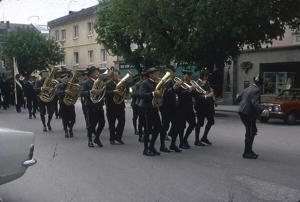 Brass band marching along a street