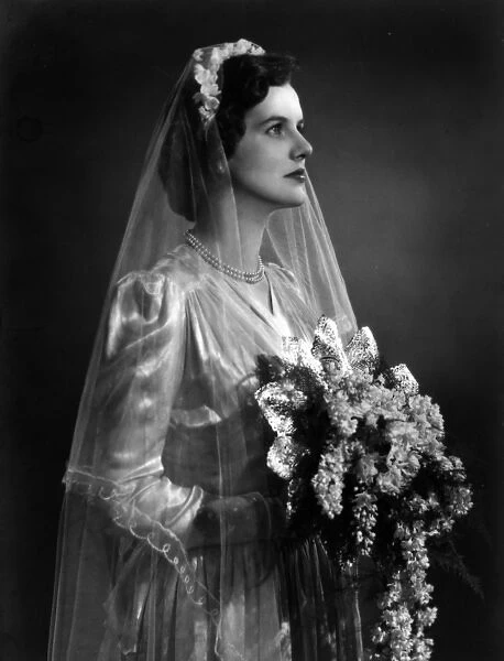 Bride with bouquet on her wedding day