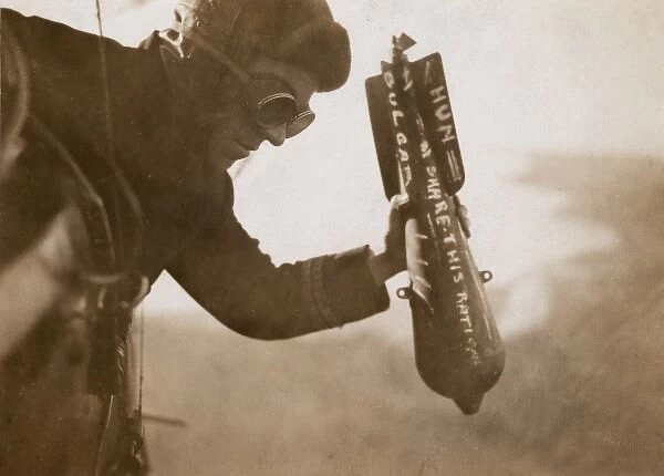 British airman dropping a bomb by hand, WW1