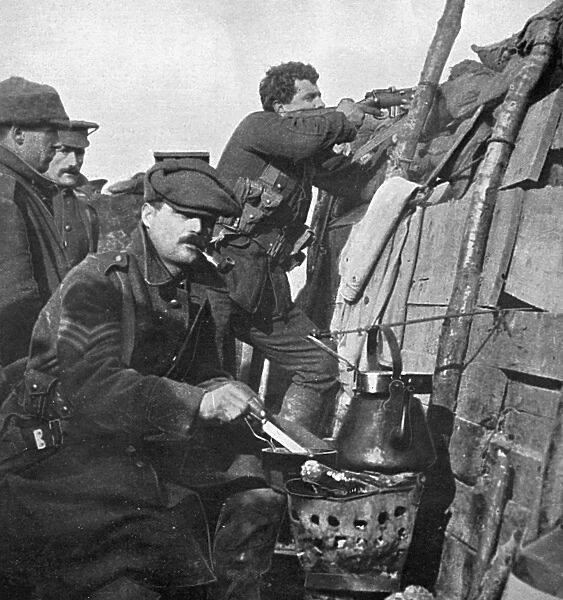 British soldier cooks dinner on a brazier in trench