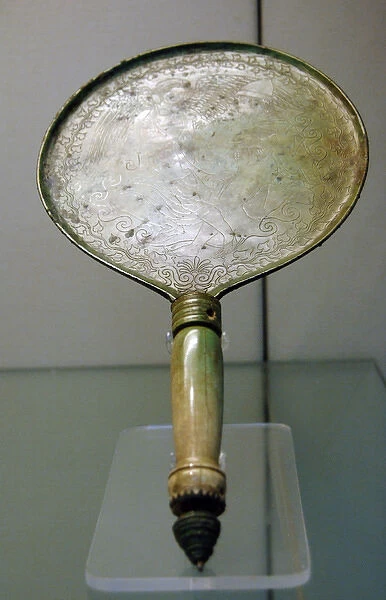 Bronze mirror with bone handle engraved with a scene depicti