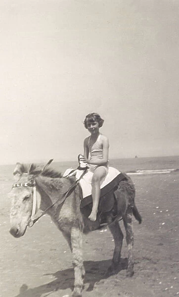 Child riding a seaside donkey